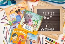 A sign by Usborne Books and More stating First Day of School